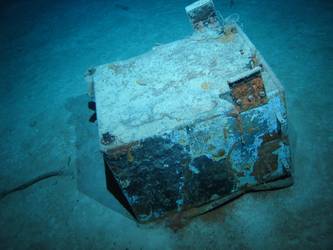 Rectangular tank or locker on seabed
